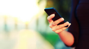Woman on Cellphone with Apps