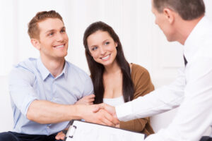 man shaking hand of a real estate agent.