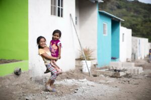 two sisters standing in village