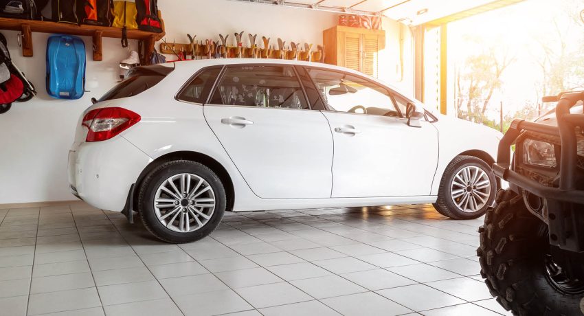interior of a clean garage with a car.