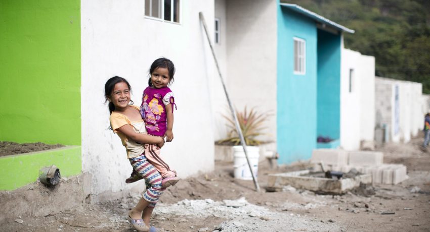 two sisters standing in village