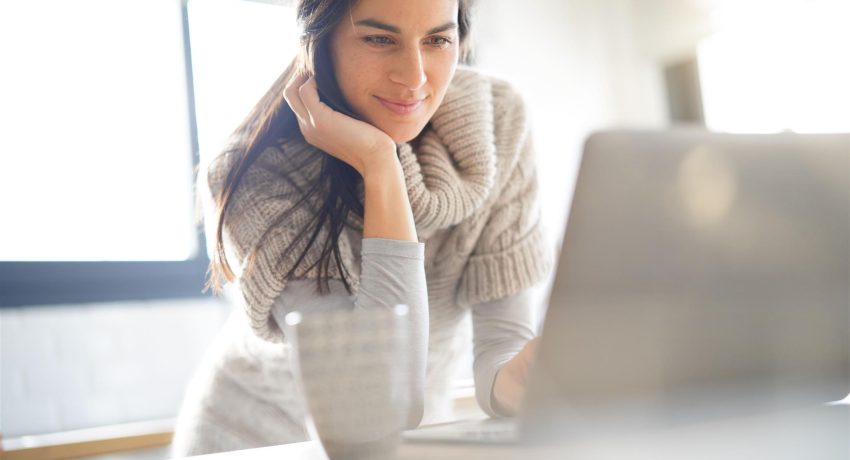 Woman Looking at Laptop