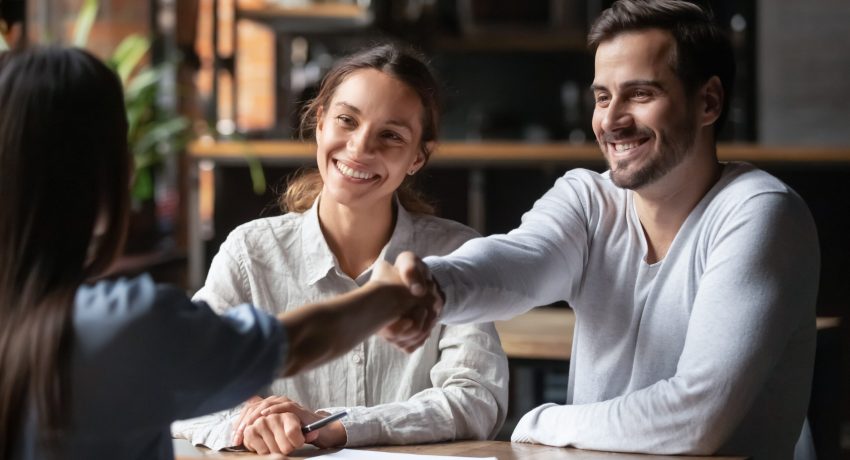 couple with real estate agent