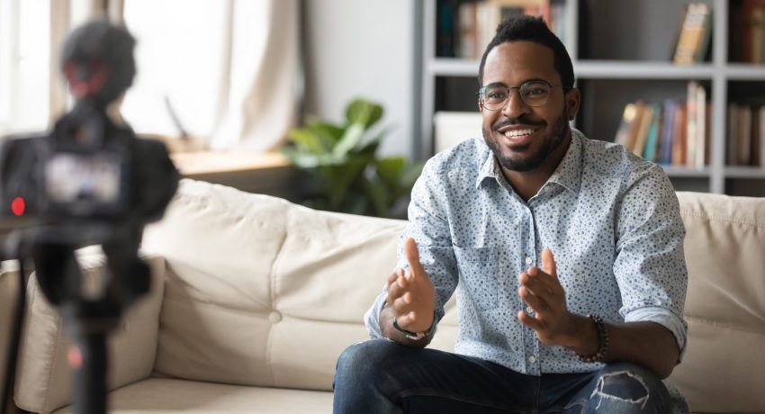 Happy,Young,African,American,Man,Speaker,In,Eyewear,Sitting,In
