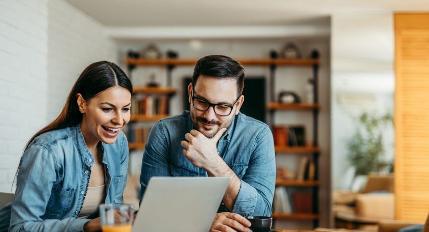 couple looking for a home on computer