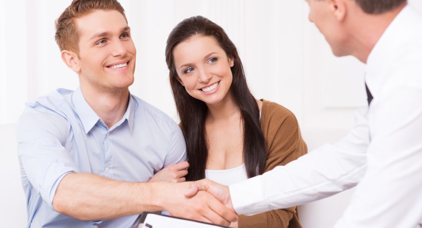 man shaking hand of a real estate agent.