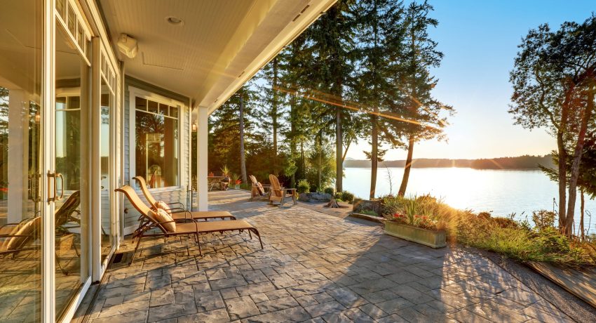 Large,Stone,Floor,Patio,Area,Of,Waterfront,House,With,Outdoor